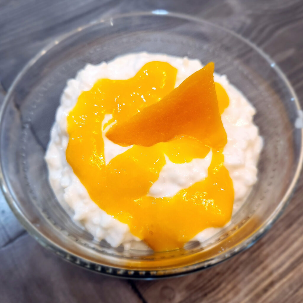 Thai coconut rice pudding with mango couli